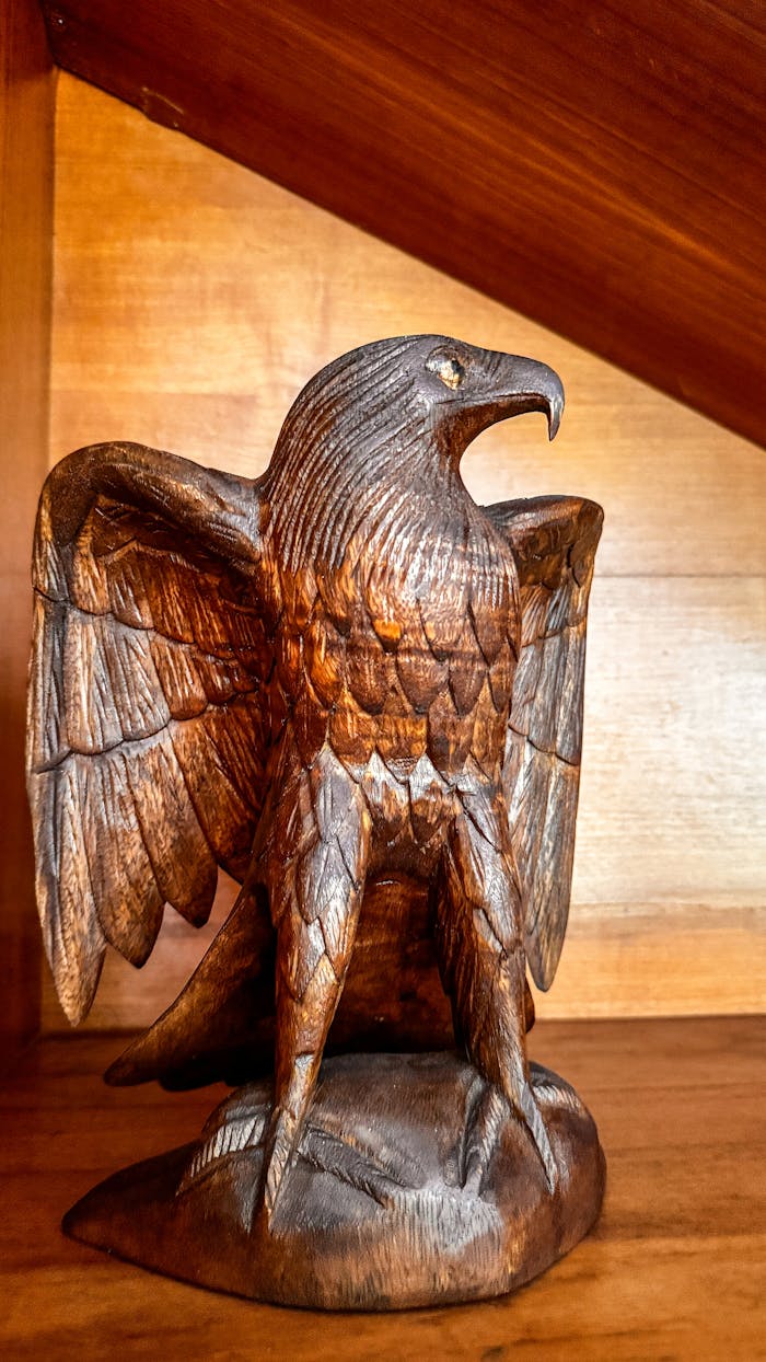 services-03 Detailed hand-carved wooden eagle sculpture in Bali, Indonesia showcasing exquisite craftsmanship.